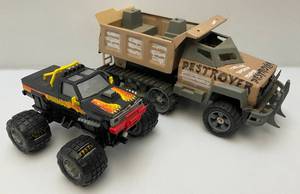 lot 13 image: Two Toy Trucks Including Animal Monster Truck And Destroyer Army Truck