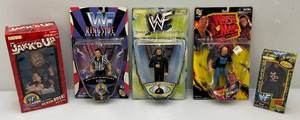 lot 22 image: Misc. Wrestling Action Figures Including Stone Cold Steve Austin And More (NEW IN PACK)