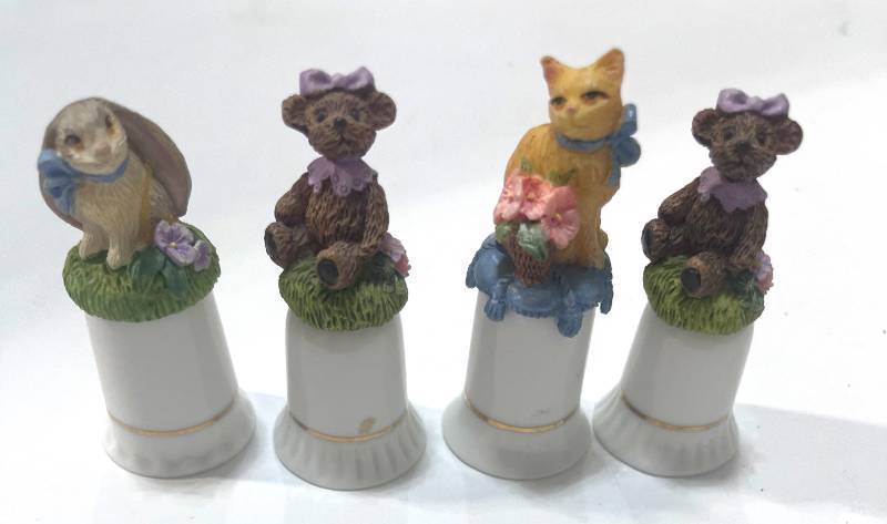 lot 22 image: Set of 4 Avon Animal Thimbles