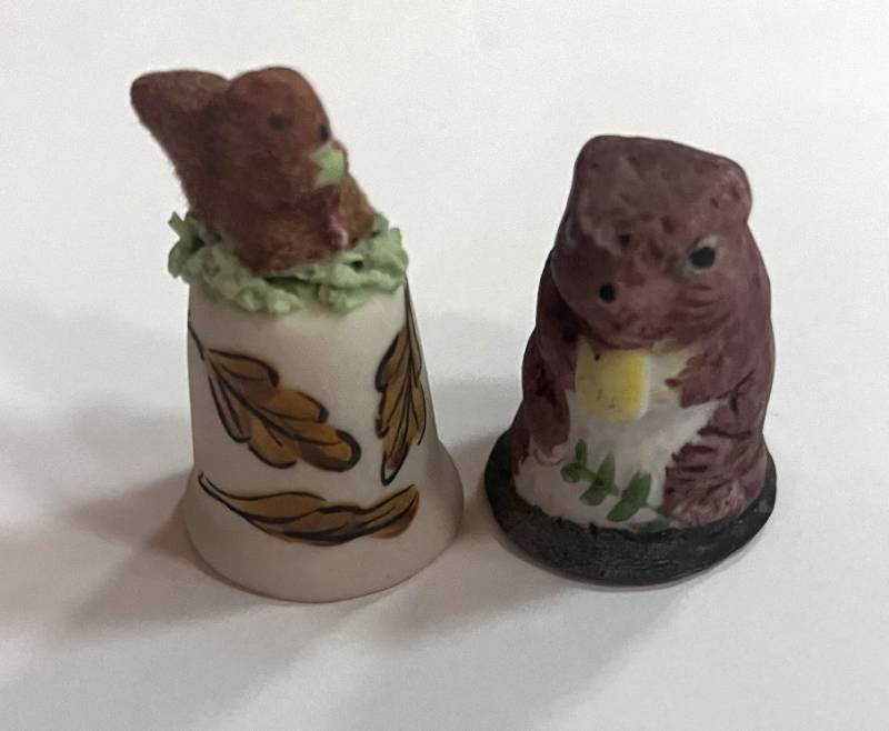 lot 36 image: Two Squirrel Thimbles