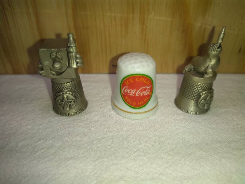 lot 182 image: 3 Coca Cola Thimbles