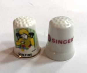 lot 238 image: Singer Advertising Thimble and Quilting Thimble