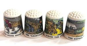 lot 230 image: 4 Train Themed Thimbles