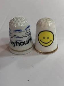 lot 40 image: Greyhound and Happy Face Thimbles