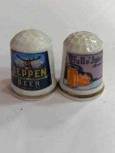 lot 34 image: Full o Juice and Deppen Beer Advertising Thimbles