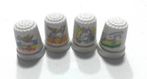 lot 54 image: 4 Unicorn Thimbles