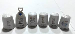 lot 48 image: 6 Precious Moments Month Thimbles