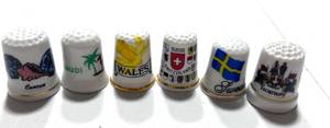 lot 70 image: 6 Souvenir Thimbles Norway, Cancun, Sweden, Arabia, Wales and Switzerland