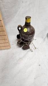 lot 55 image: Wildcat Aged in the Woods jug w4 shot glasses) carriage-no horsedeer