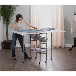 lot 124 image: Hobby Craft 60 in. W x 36 in. D MDF Folding Fabric Cutting Table with Drawers, Adjustable Height, Silver  White