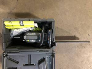 lot 49 image: Ryobi Chainsaw with Battery and Charger  Customer Returns See Pictures