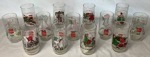 lot 97 image: Vintage Collection of 13 American Greetings Corp. Holly Hobby & Coca-Cola Glasses (Ranging from 1977-1983)