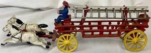 lot 168 image: John Wright Cast Iron Horse-Drawn Fire Truck with 2 Ladders and 1 Driver (14.5L x 5.25H)