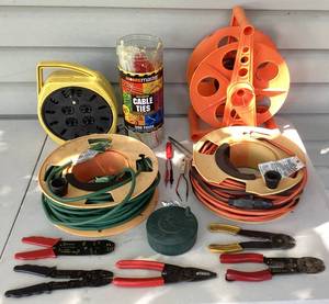 lot 187 image: Collection of 14 Gauge Extension Cords, Wire Strippers, Various Cable Ties, Cord Reels and Voltage Tester