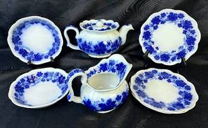 lot 34 image: Antique Gefle Vinranka Flow Blue Grape Vine & Leaf Pattern Pitcher, Teapot, 2 Bowls, and 3- 7.5 Plates - Made in Sweden