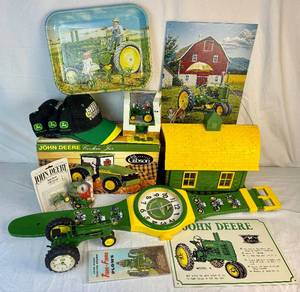 lot 164 image: Large Assortment of John Deere Collectables - Includes Wall Signs, Cookie Jar, Wall Watch, 2 Desk Clocks, Daddys Girl Tray, 3 John Deere Hats, Stocking Holder, and Bird Feeder
