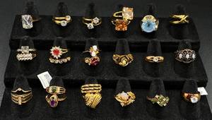 lot 230 image: Collection of 27 Gold Tone Rings Size 7-8