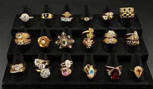 lot 232 image: 31 Gold Tone Rings Sizes 8-9