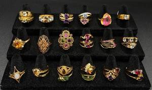 lot 236 image: Collection of 31 Gold Tone Rings Sizes 9-10.5