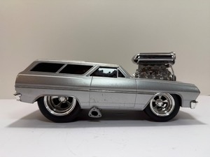 lot 84 image: Muscle Machines 118 Scale 1965 Chevy Chevelle SS Wagon Silver Diecast Car Blower Street Rod