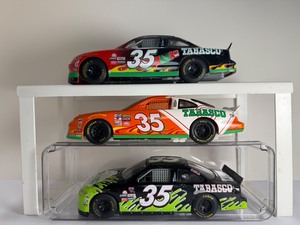 lot 196 image: RARE Lot of 3 1998 Todd Bodine #35 Tabasco Pontiac Grand Prix Diecast Cars (Black, Green, OrangeWhite)