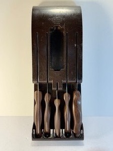 lot 27 image: RARE Vtg Mid-Century CUTCO 5-Pc Kitchen Knife Set &amp Original Brown BakelitePlastic Wall Mount Holder  USA Made Collectible Cutlery  Thermo-Resin Dark Wood Grain Handles  Forever Guarantee Included