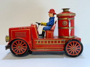 lot 171 image: Vintage Modern Toys Japan Tin Litho Friction F.D. No. 1 Fire Engine Truck w Fireman Figure (c. 1950s)