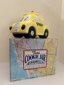 lot 172 image: Vintage Yellow Taxi Cab Earthenware Cookie Jar - Lights &amp Sound (AMC NY)