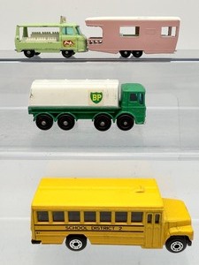lot 73 image: Lot of 4 Vintage Matchbox Diecast Vehicles - Lesney No. 23 Caravan, No. 32 BP Tanker, Van &amp School Bus