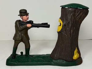 lot 38 image: Vintage Style Cast Iron Mechanical Coin Bank Teddy and the Bear Hunter Shooting Scene