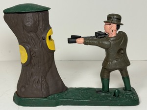 lot 38 image: Vintage Style Cast Iron Mechanical Coin Bank Teddy and the Bear Hunter Shooting Scene