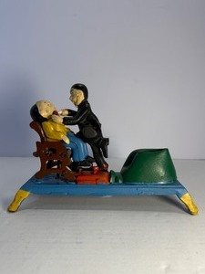 lot 30 image: VINTAGE Cast Iron The Dentist Mechanical Coin Bank  Nostalgic Tooth Pulling Action  Works