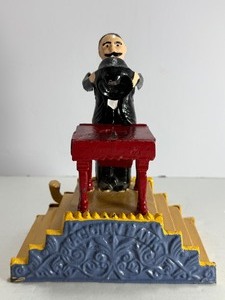 lot 89 image: VINTAGE Cast Iron Magician Mechanical Coin Bank&nbsp