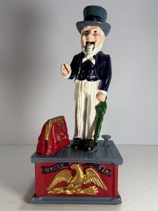 lot 62 image: Vintage Cast Iron Mechanical Bank - Uncle Sam Design