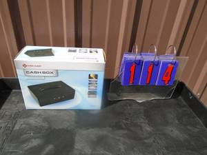 lot 114 image: New First Alert cash box with keys. As shown.