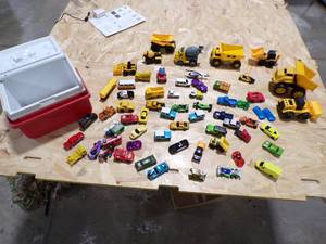 lot 273 image: A SMALL COOLER FILLED WITH TOY CARS AND HEAVY EQUIPMENT RIGS