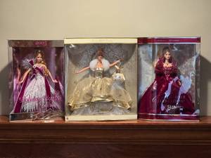 lot 83 image: Celebration Barbie Collection with Original Packaging - Holiday Barbie 2005 - Celebration Barbie 2000 - Holiday Celebration Barbie 2002