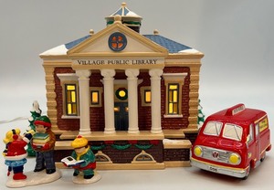 lot 12 image: Department 56 Village Public Library Ceramic Lighted Building with Bookmobile and Figures