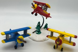 lot 15 image: Department 56 Snow Village Airplane Figurines Set Spirit Yellow Blue Planes