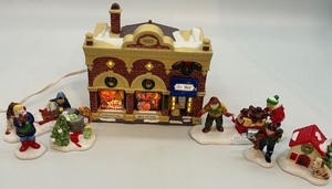 lot 25 image: Department 56 Snow Village Pet Shop Lighted House with Figurines 