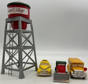 lot 43 image: Department 56 Snow Village Watertower Accessory with 3 Handpainted Ceramic Vehicles