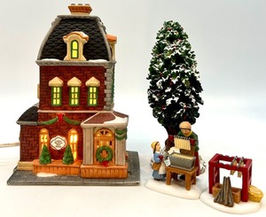 lot 103 image: Department 56 Heritage Village Collection Christmas in the City Set - Haberdashery, Holly Tree, and Candle Makers Figures