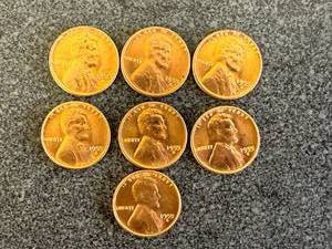 lot 61 image: 7 Shiny 1955 S Wheat Pennies