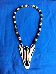 lot 2 image: Lee Sands Zebra Gold Tone Pendant and Beads Necklace