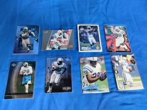 lot 66 image: 8 Marshall Faulk Football Cards