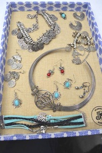 lot 20 image: Lot of Fashion Jewelry - Silver Tone Coin Jewelry and Beaded Bracelets