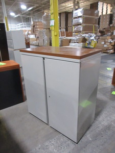 lot 230 image: HERMAN MILLER TWO DOOR STORAGE CABINET WITH WOOD TOP