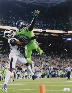 lot 28 image: DK Metcalf Signed Seahawks 11x14 Photo (JSA COA)
