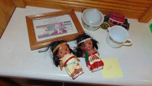 lot 64 image: Vintage Pyrex Sugar and Creamer, 2 Indian Dolls, Cast Iron Bank and Framed Currency