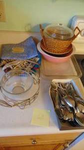 lot 68 image: Silverware, Glass Baking Pans, Potholders, and Pink Pyrex Dish